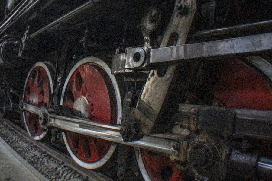 China Railway Museum, Dongjiao Exhibition Hall display hall with a full-size steam locomotive standing on track beside a walkway